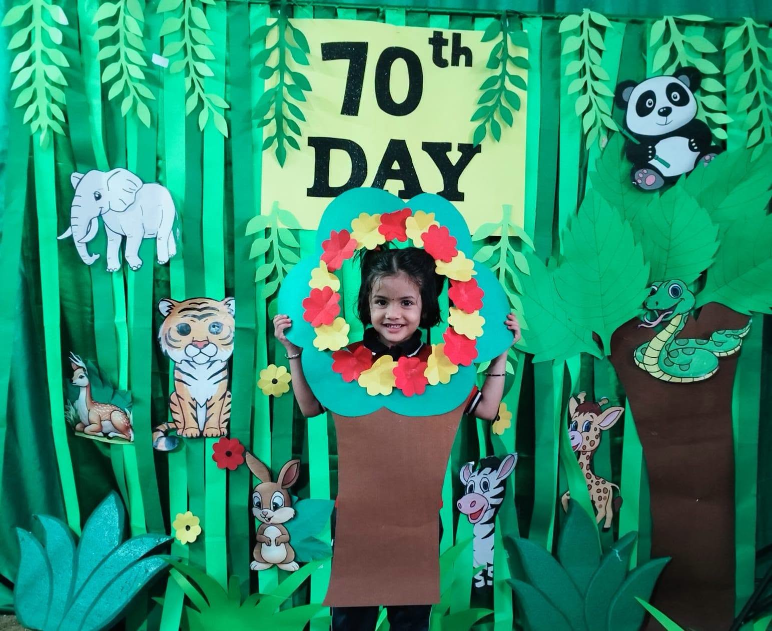 Child smiling through a handmade flower frame